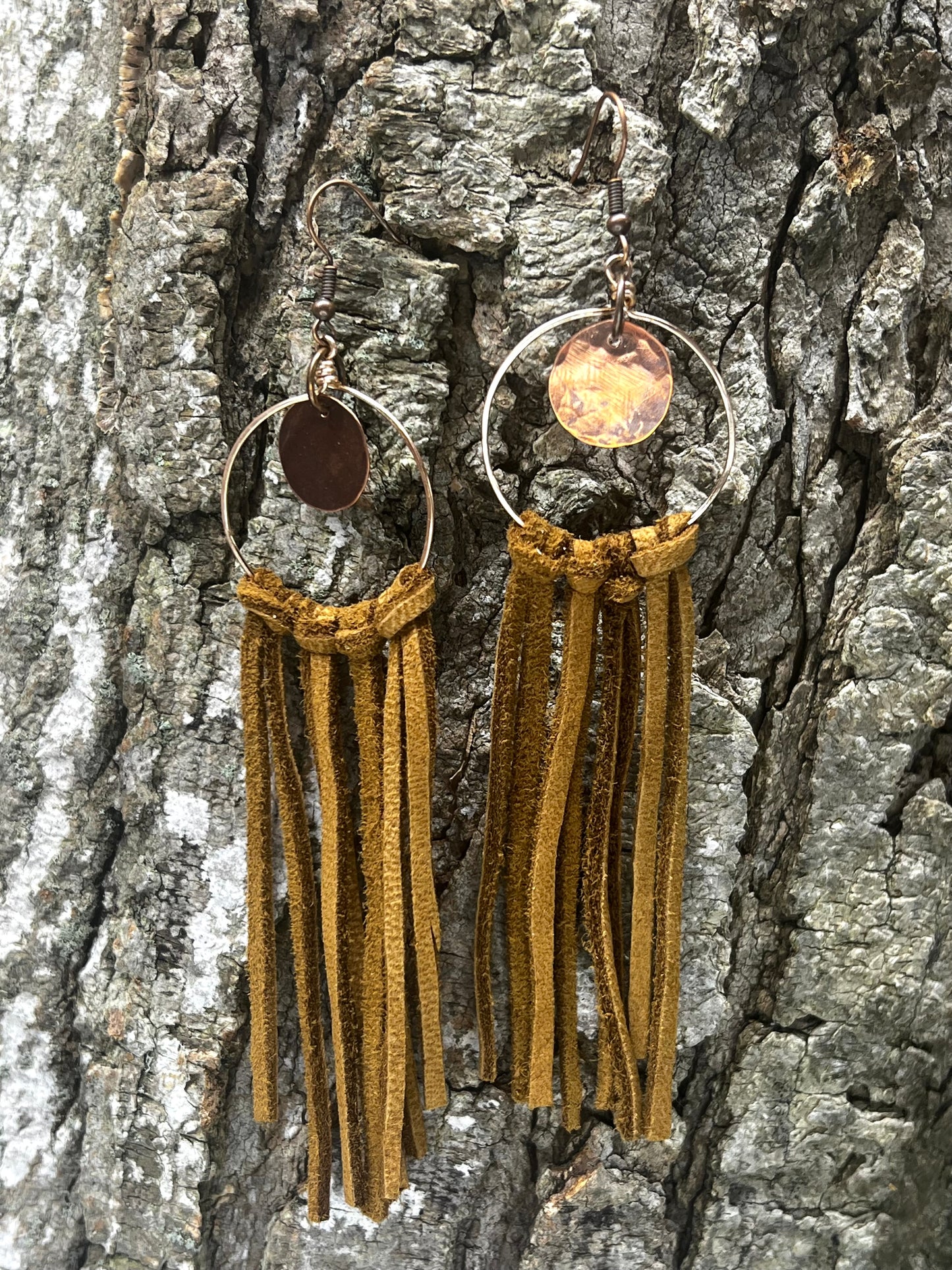 #107 hammered copper disc with leather fringe
